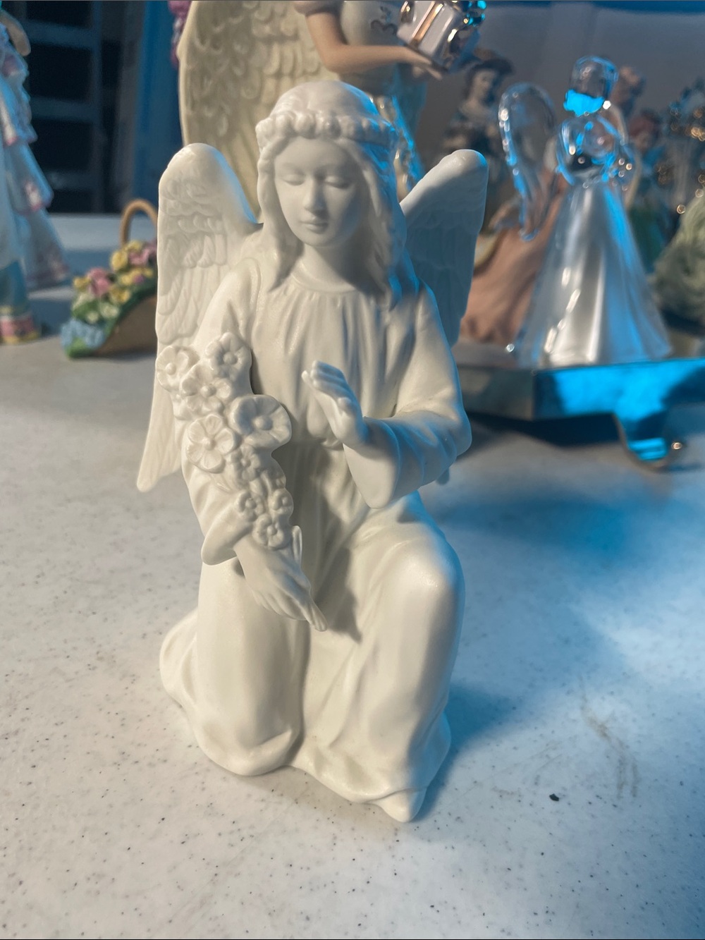 White Ceramic Kneeling Angel Figurine with Flower Bouquet